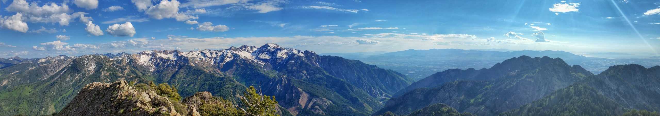 Rocky summit views from Mount Raymond with rugged peaks and green valleys, part of the challenging hikes Salt Lake City offers.