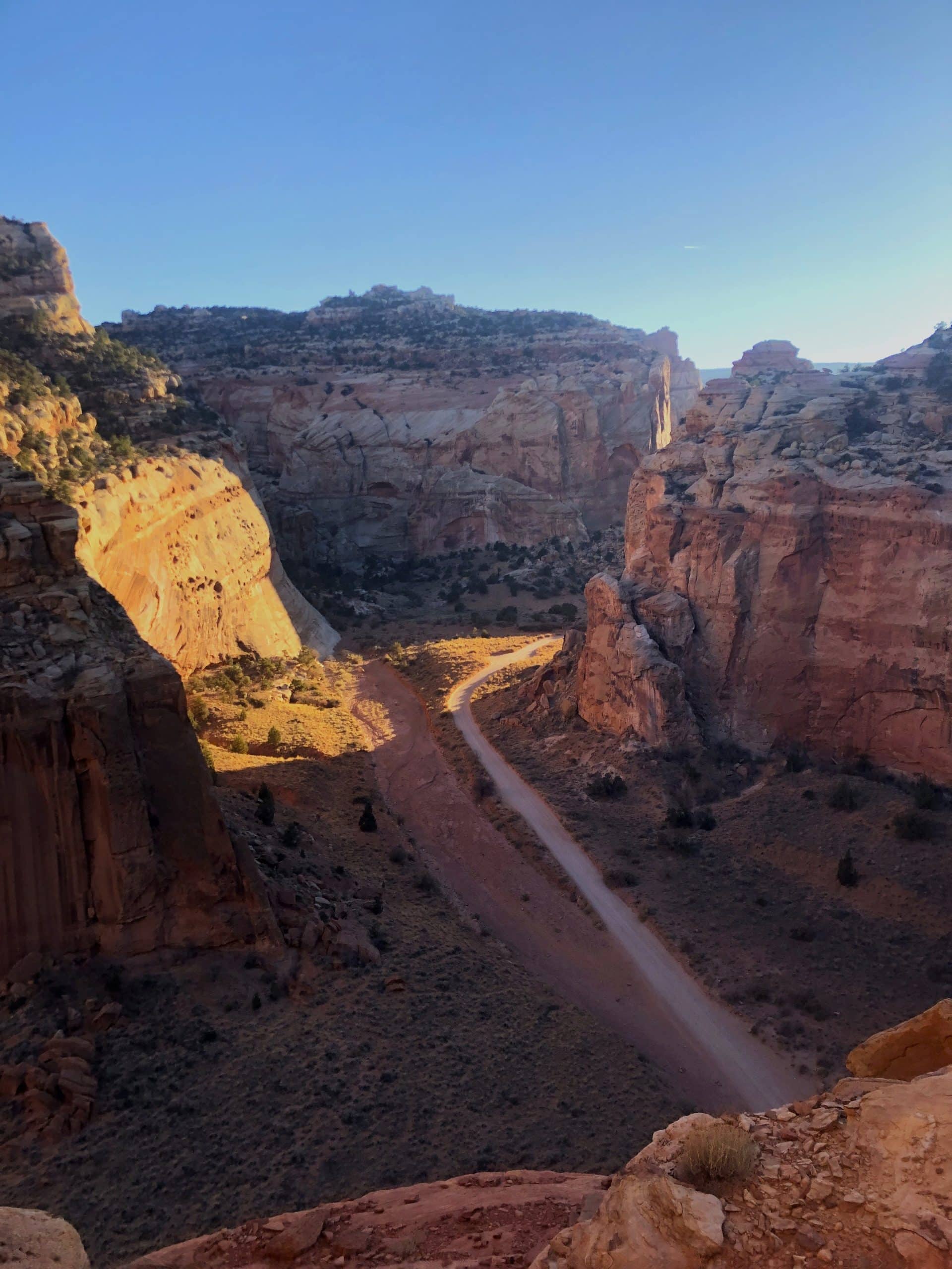 The Grand Wash winding through a deep red rock canyon as seen from Cassidy Arch Trail in Capitol Reef National Park. 