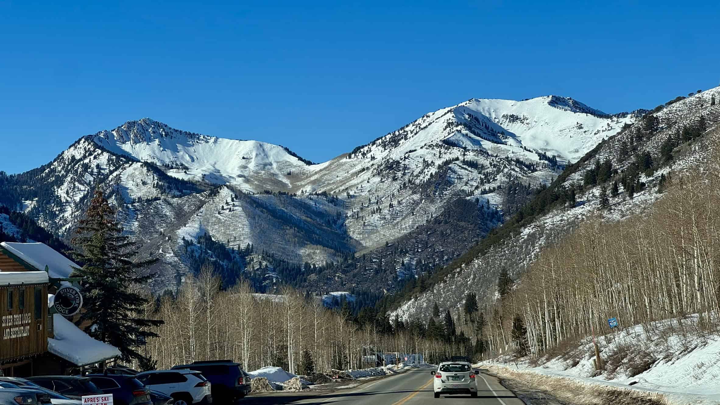 Snow-covered Mount Raymond on the left and Gobblers Knob on the right, viewed from Silver Fork Lodge in Big Cottonwood Canyon