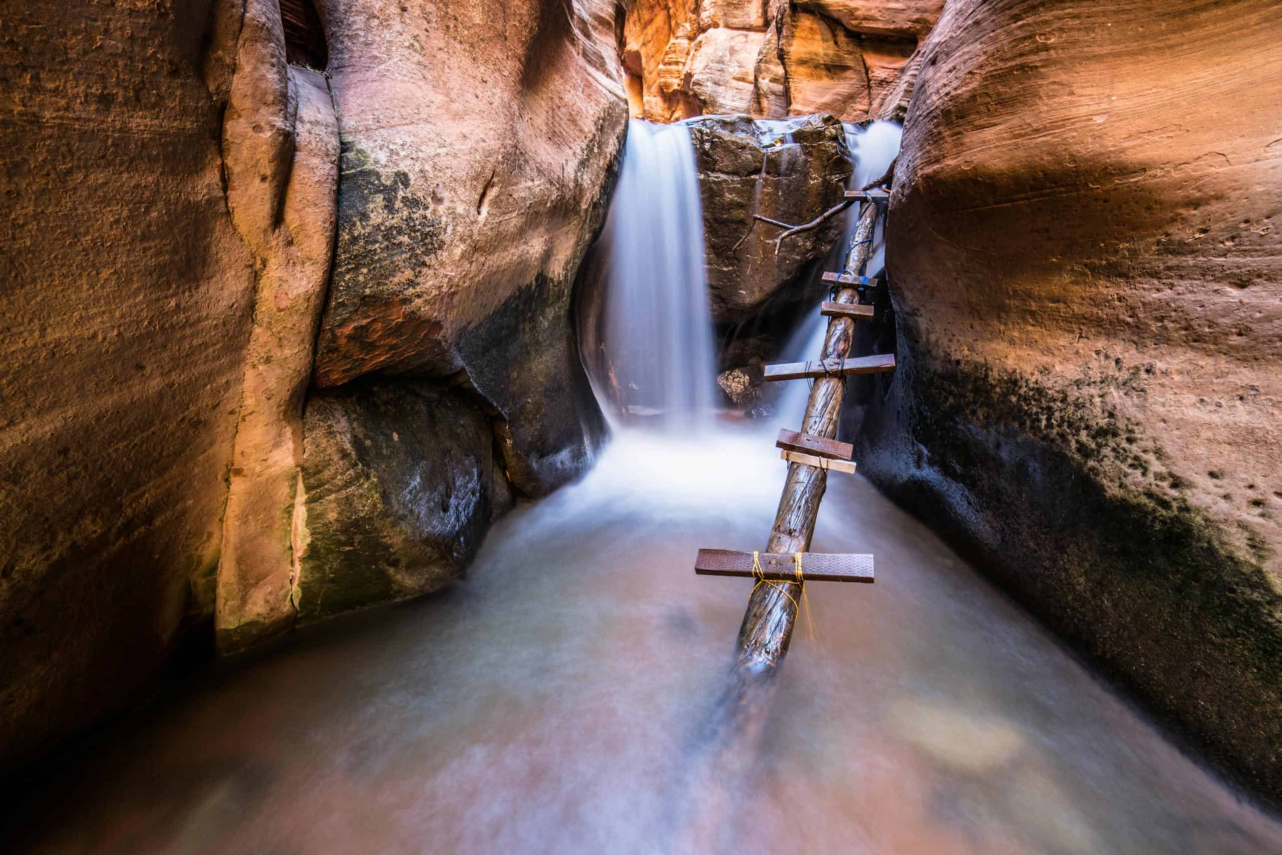 Experience the beauty of a waterfall in Kanarraville Canyon, Utah's stunning landscape.