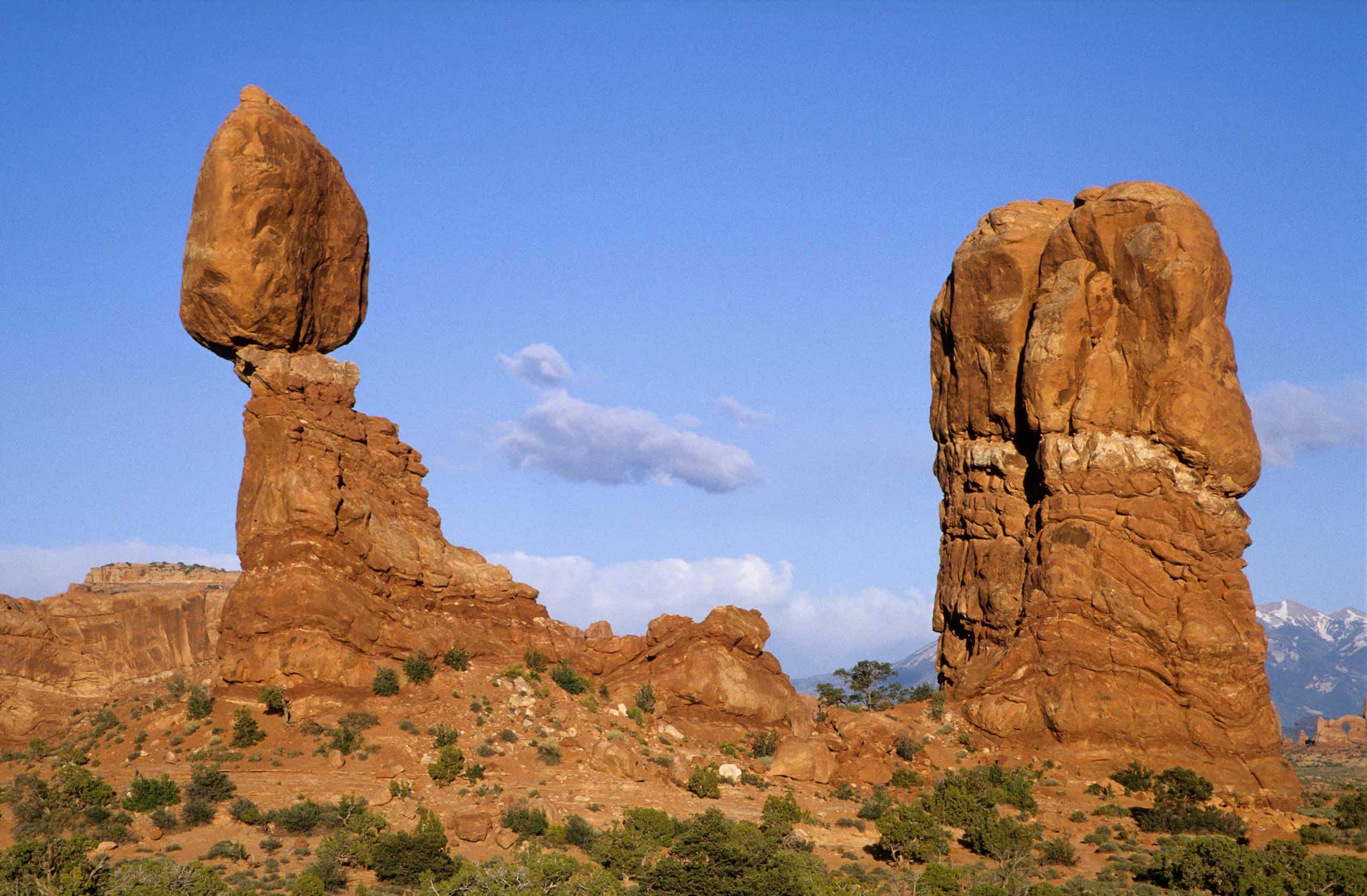 Iconic Balanced Rock formation under a clear blue sky in Arches National Park, Utah.