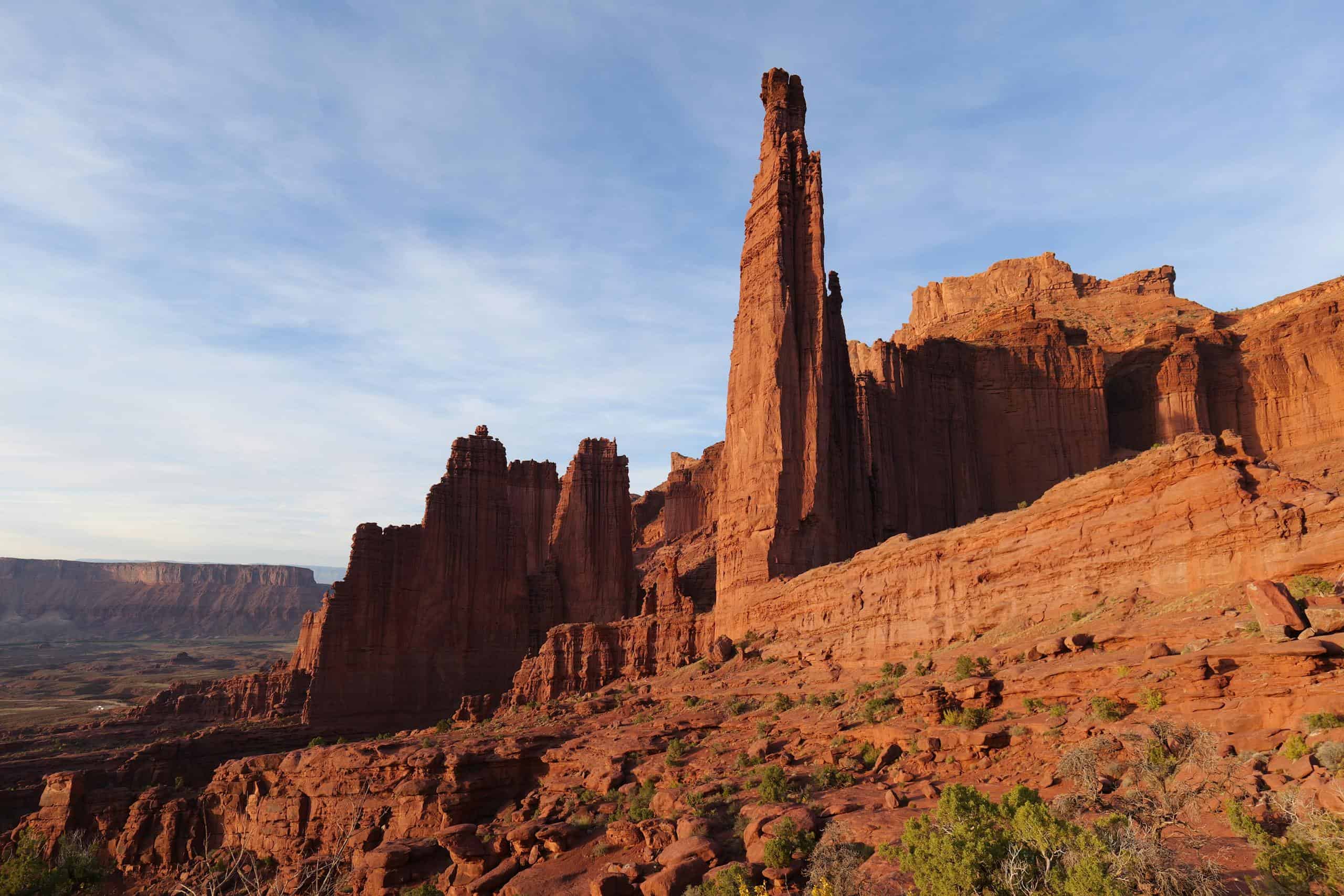 Stunning red rock formations under a clear blue sky, showcasing desert geology's beauty.