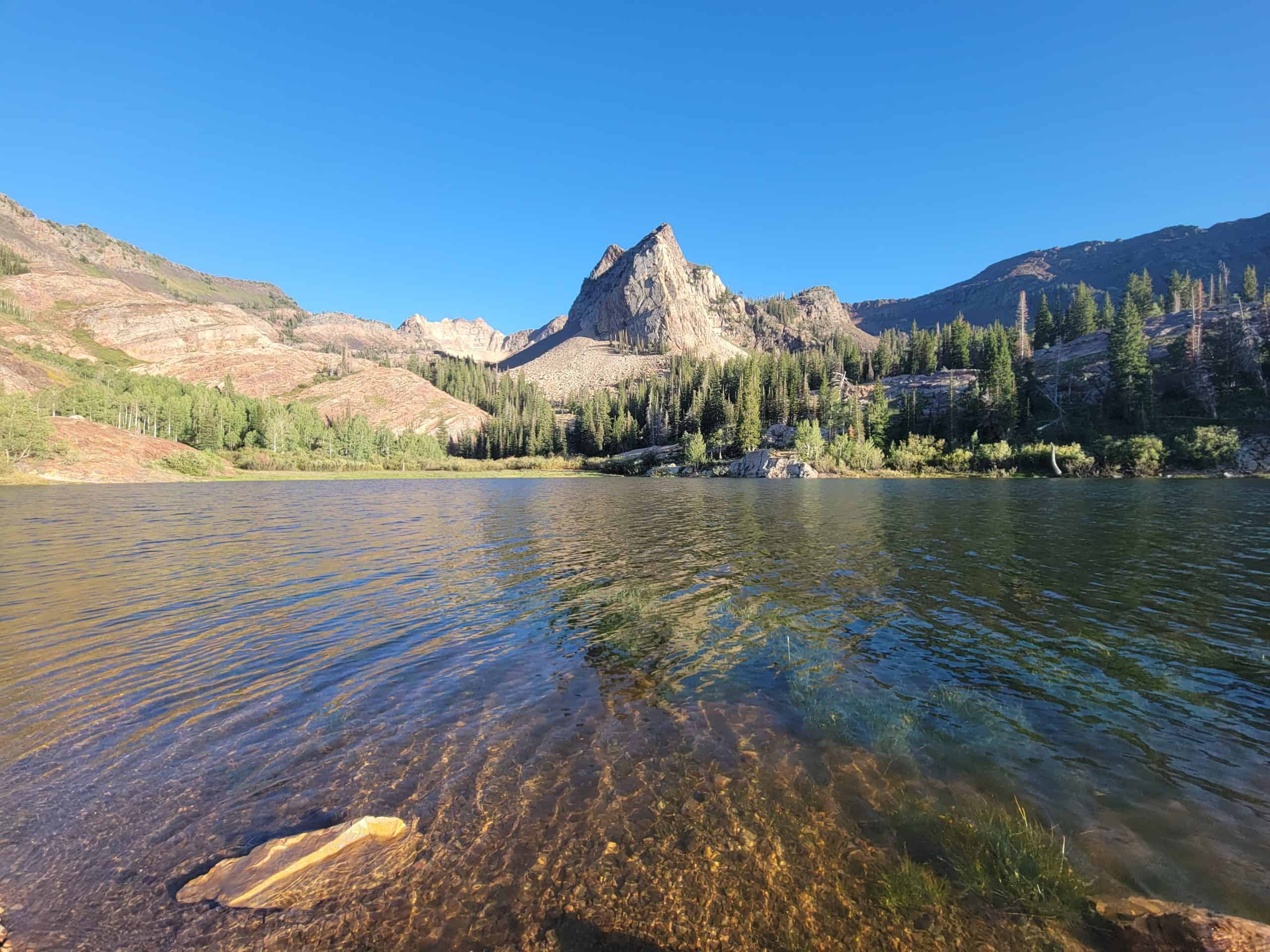 One of the best hikes in Utah showcasing the glass-like waters of Lake Blanche, and the surrounding mountain peaks.

