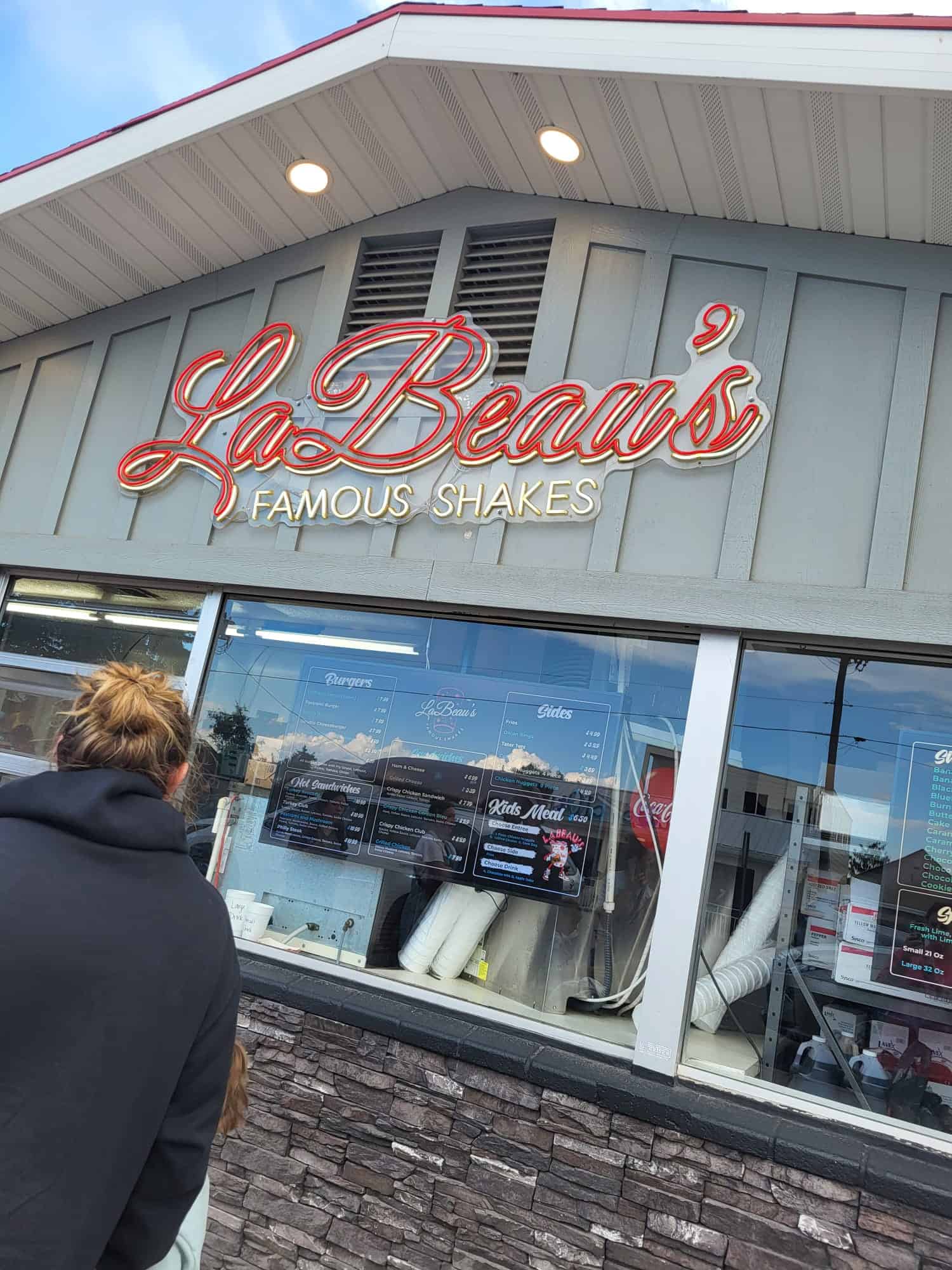 A woman standing in line at LeBeau's Famous Shakes restaurant in Garden City, Utah

