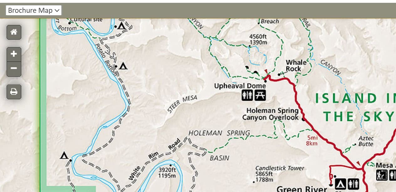 National Park Brochure  map highlights key routes and overlooks in the Island in the Sky district, including the Holeman Spring Canyon Overlook and Upheaval Dome. 
